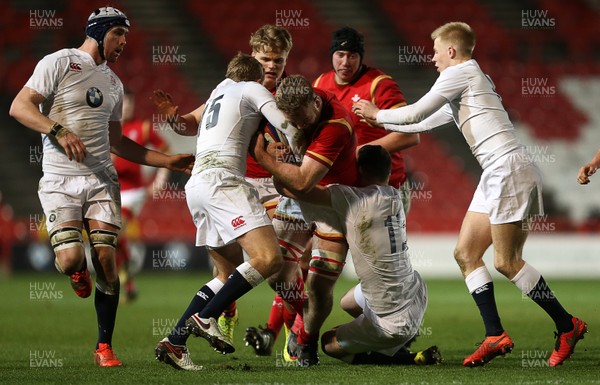 110316 - England U20 v Wales U20 - RBS 6 Nations - Tom Phillips of Wales is tackled by Max Malins and George Worth of England