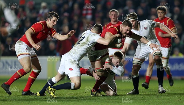 110316 - England U20 v Wales U20 - RBS 6 Nations - Harrison Keddie of Wales is tackled by George Worth and Mathew Protheroe of England