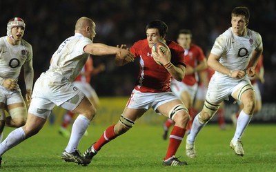 240212 - England Under 20 v Wales Under 20 - Under 20 Six Nations -Ellis Jenkins of Wales is tackled by Koree Britton of England