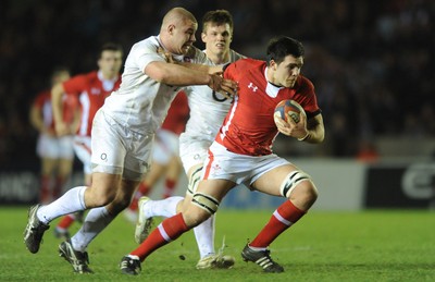 240212 - England Under 20 v Wales Under 20 - Under 20 Six Nations -Ellis Jenkins of Wales is tackled by Koree Britton of England