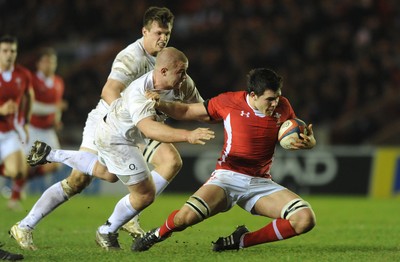 240212 - England Under 20 v Wales Under 20 - Under 20 Six Nations -Ellis Jenkins of Wales is tackled by Koree Britton of England