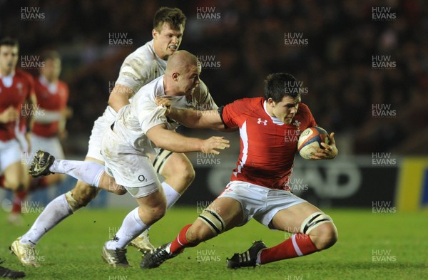 240212 - England Under 20 v Wales Under 20 - Under 20 Six Nations -Ellis Jenkins of Wales is tackled by Koree Britton of England