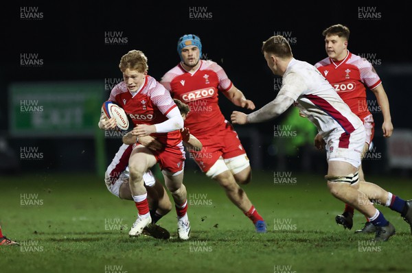 250222 - England U20s v Wales U20s U20s Six Nations Championship 2022 - Harri Houston of Wales is tackled by Toby Knight of England