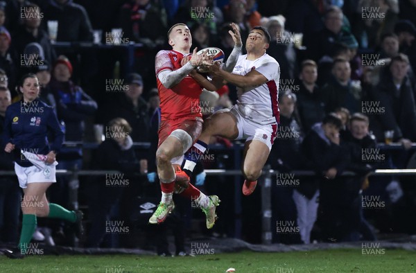 250222 - England U20s v Wales U20s U20s Six Nations Championship 2022 - Cameron Winnett of Wales takes the ball from Cassius Cleaves of England
