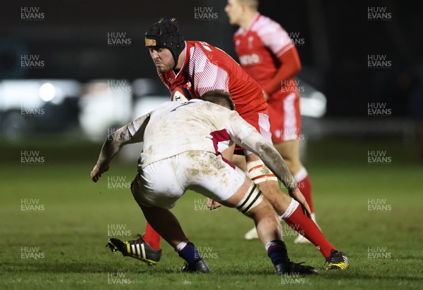 250222 - England U20s v Wales U20s U20s Six Nations Championship 2022 - Lewis Jones of Wales takes on Toby Knight of England