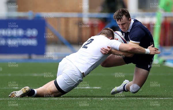 250621 - England U20s v Scotland U20s - U20s 6 Nations Championship - Michael Gray of Scotland is tackled by Sam Riley of England