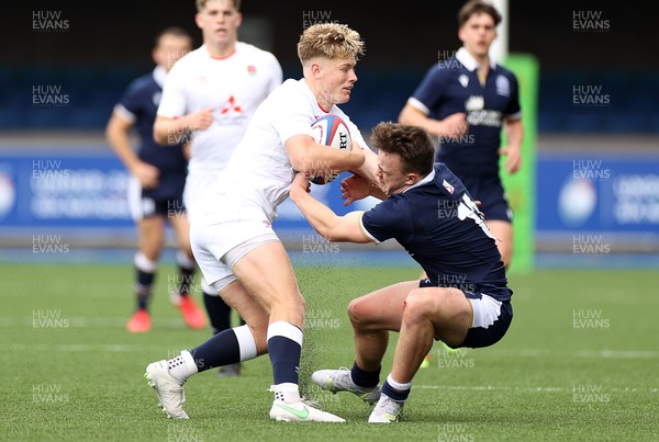 250621 - England U20s v Scotland U20s - U20s 6 Nations Championship - Fin Smith of England is tackled by Michael Gray of Scotland