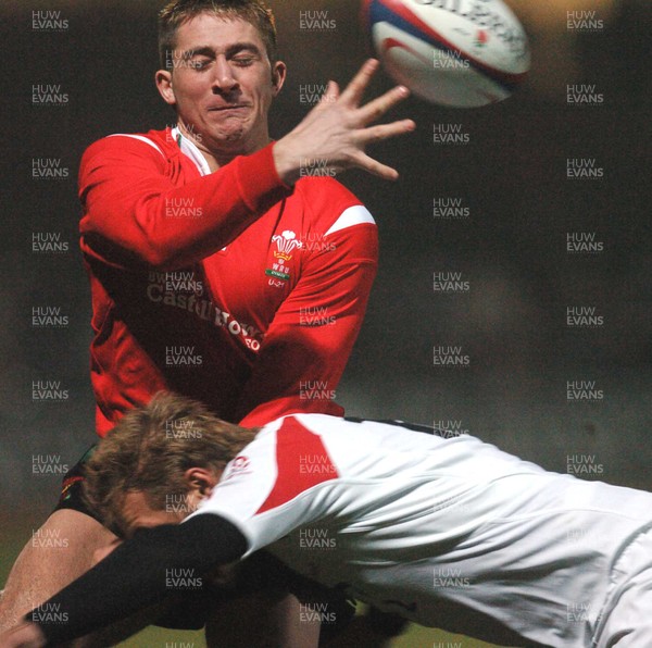 030206 - England U21 v Wales U21 - Six Nations -  Darren Daniel of Wales releases as Olly Morgan tackles