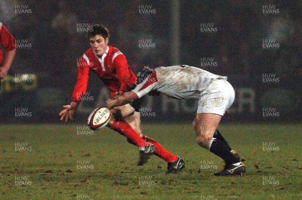 030206 - England U21 v Wales U21 - Six Nations -  Andrew Bishop of Wales spills the ball as Michael Hills tackles