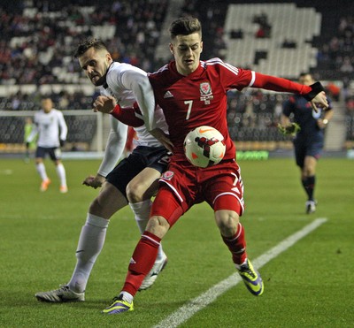 050314 - England U'21's vs Wales U'21's -EUFA U'21's Qualifying Group One-Tom Lawrence of Wales battles with England's Carl Jenkinson(c) Huw Evans Agency