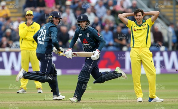 160618 - England v Australia - Royal London ODI Series - Jason Roy and Joe Root of England runs past Jhye Richardson of Australia