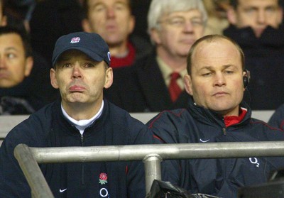 150203 - England v France - Six Nations Championship - England Coach Clive Woodward and assistant Andy Robinson look less than pleased as the referee adds on a lot of injury time