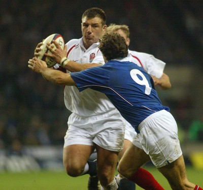 150203 - England v France - Six Nations Championship - French Scrum half Fabien Galthie tries to stop the charge of England prop Julian White