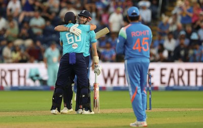 160726 - England v India, Second Metro Bank One Day International, Cardiff - Gus Atkinson of England and Joe Root of England embrace after Atkinson hits the winning runs
