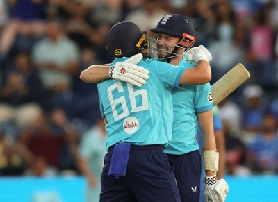 160726 - England v India, Second Metro Bank One Day International, Cardiff - Gus Atkinson of England and Joe Root of England embrace after Atkinson hits the winning runs