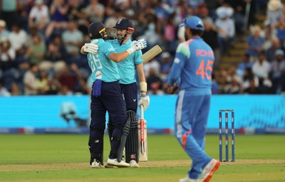 160726 - England v India, Second Metro Bank One Day International, Cardiff - Gus Atkinson of England and Joe Root of England embrace after Atkinson hits the winning runs