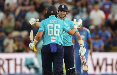 160726 - England v India, Second Metro Bank One Day International, Cardiff - Gus Atkinson of England and Joe Root of England embrace after Atkinson hits the winning runs