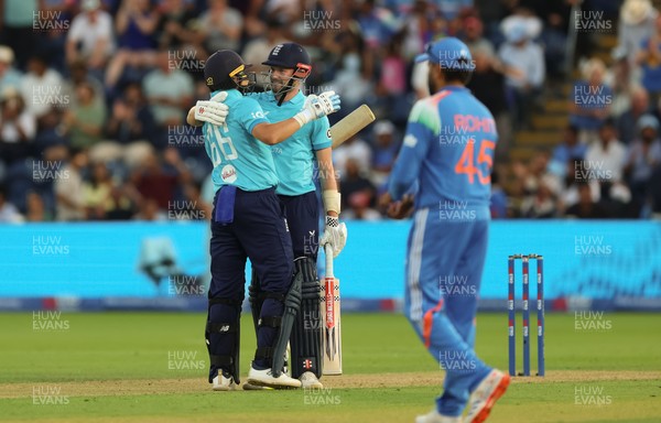 160726 - England v India, Second Metro Bank One Day International, Cardiff - Gus Atkinson of England and Joe Root of England embrace after Atkinson hits the winning runs