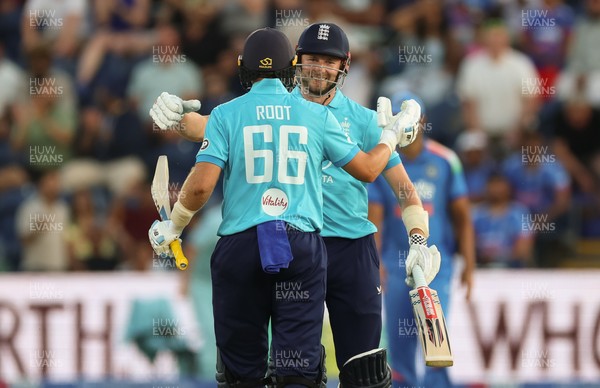 160726 - England v India, Second Metro Bank One Day International, Cardiff - Gus Atkinson of England and Joe Root of England embrace after Atkinson hits the winning runs