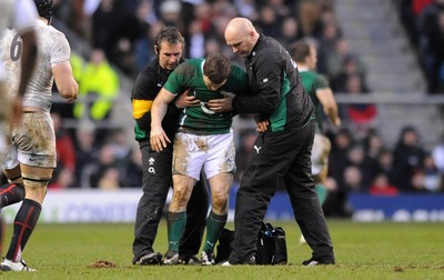 27.02.10 - England v Ireland - RBS Six Nations 2010 - Brian O'Driscoll of Ireland is helped to the ground by medical staff. 