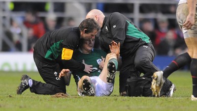 27.02.10 - England v Ireland - RBS Six Nations 2010 - Brian O'Driscoll of Ireland is helped to the ground by medical staff. 