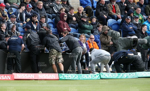 060617 - England v New Zealand - ICC Champions Trophy - Workmen put LED boards back up after being blown over in the wind