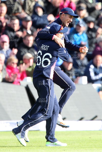 060617 - England v New Zealand - ICC Champions Trophy - Alex Hales of England celebrates with Joe Root after catching Corey Anderson of New Zealand