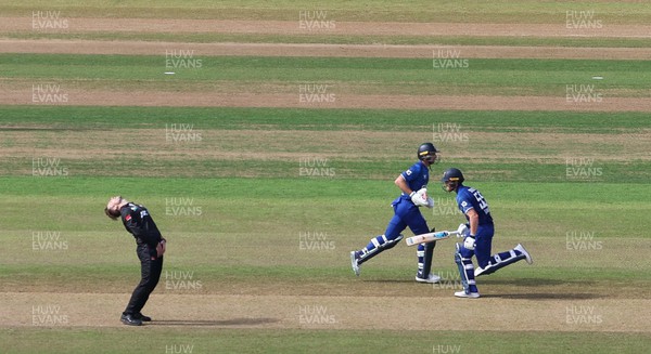 080923 - England v New Zealand, Metro Bank ODI Series - Lockie Ferguson of New Zealand reacts as Ben Stokes of England and Jos Buttler of England build their partnership
