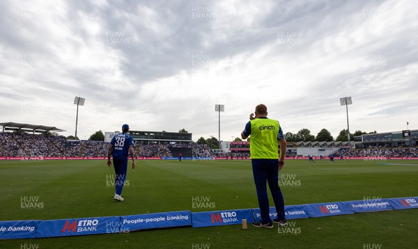 080923 - England v New Zealand, Metro Bank ODI Series - Jonny Bairstow brings Reece Topley of England some water as he stands on the boundary during the New Zealand innings