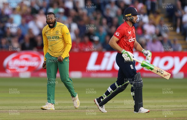 280722 - England v South Africa - IT20 - Andile Phehlukwayo of South Africa celebrates as Joe Butler walks off after being caught out by Reeza Hendricks