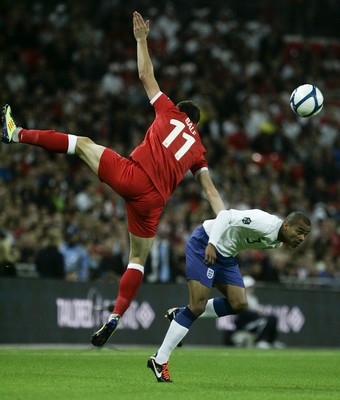 06.09.11 -  England v Wales -UEFA Euro 2012 Qualifier Group G ....  Wales's Gareth Bale jumps for the ball above England's Ashley Cole. 
