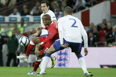 06.09.11 -  England v Wales -UEFA Euro 2012 Qualifier Group G ....  Wales' Robert Earnshaw is put under pressure from England's Stewart Downing & Chris Smalling. 