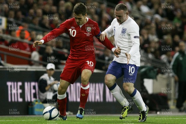 06.09.11 -  England v Wales -UEFA Euro 2012 Qualifier Group G ....  Wales's Captain Aaron Ramsey is put under pressure from England Wayne Rooney. 