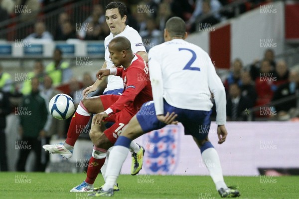 06.09.11 -  England v Wales -UEFA Euro 2012 Qualifier Group G ....  Wales' Robert Earnshaw is put under pressure from England's Stewart Downing & Chris Smalling. 