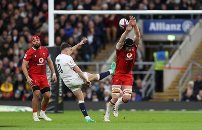070226 - England v Wales - Guinness Six Nations - Adam Beard of Wales challenges the kick of George Ford of England 