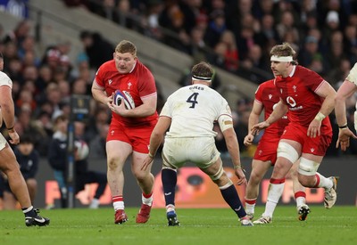 070226 - England v Wales - Guinness Six Nations - Rhys Carre of Wales is tackled by Alex Coles of England 