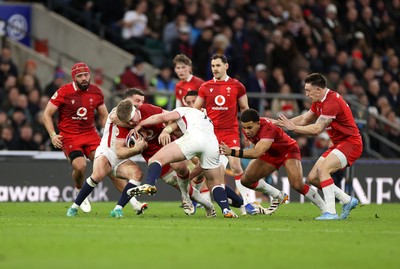 070226 - England v Wales - Guinness Six Nations - Aaron Wainwright of Wales is tackled by George Ford of England 