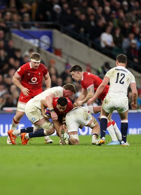 070226 - England v Wales - Guinness Six Nations - Ben Thomas of Wales is tackled by Ollie Chessum of England 