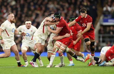 070226 - England v Wales - Guinness Six Nations - Adam Beard of Wales is tackled by Jamie George of England 