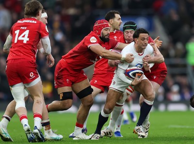 070226 - England v Wales, 2026 Guinness Six Nations - Alex Mitchell of England is held by Adam Beard of Wales and Josh Macleod of Wales
