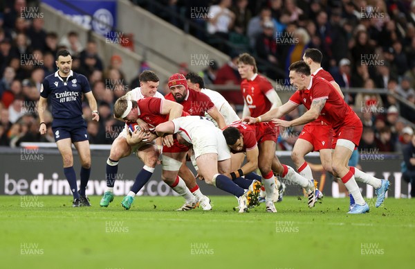 070226 - England v Wales - Guinness Six Nations - Aaron Wainwright of Wales is tackled by George Ford of England 