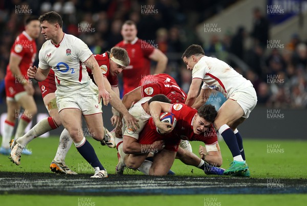 070226 - England v Wales - Guinness Six Nations - Eddie James of Wales is tackled by Freddie Steward of England 