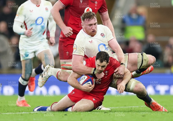 070226 - England v Wales, 2026 Guinness Six Nations - Tomos Williams of Wales is tackled by Ollie Chessum of England
