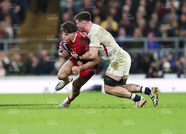 070226 - England v Wales, 2026 Guinness Six Nations - Eddie James of Wales is tackled by Tom Curry of England