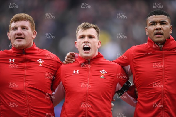 070320 - England v Wales - Guinness Six Nations - Rhys Carre, Nick Tompkins and Leon Brown of Wales during the anthems