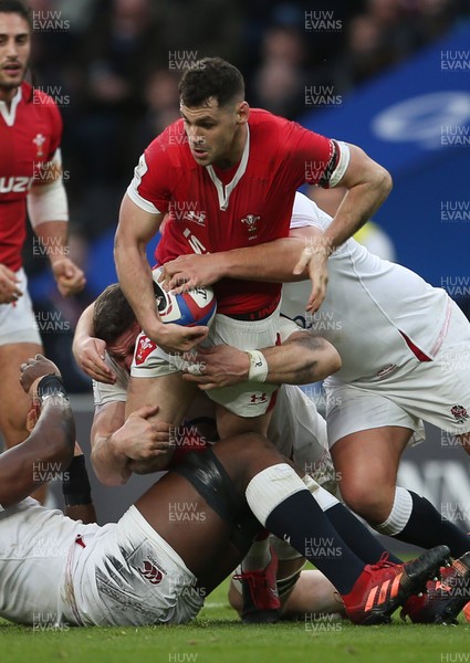 070320 - England v Wales - Guinness 6 Nations Championship - Tomos Williams of Wales is tackled by Tom Curry of England
