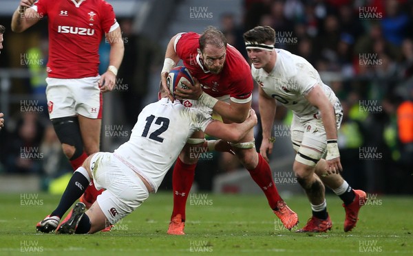 070320 - England v Wales - Guinness 6 Nations Championship - Alun Wyn Jones of Wales is tackled by Owen Farrell of England