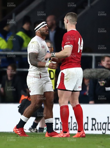 070320 - England v Wales - Guinness 6 Nations Championship - Manu Tuilagi of England hugs George North of Wales after being given a red card for his tackle on him by Referee Ben O'Keeffe