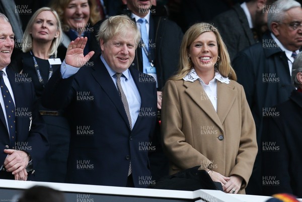070320 - England v Wales, Guinness Six Nations 2020 - Prime Minister Boris Johnson and Carrie Symonds take their seats in the stand ahead of the match