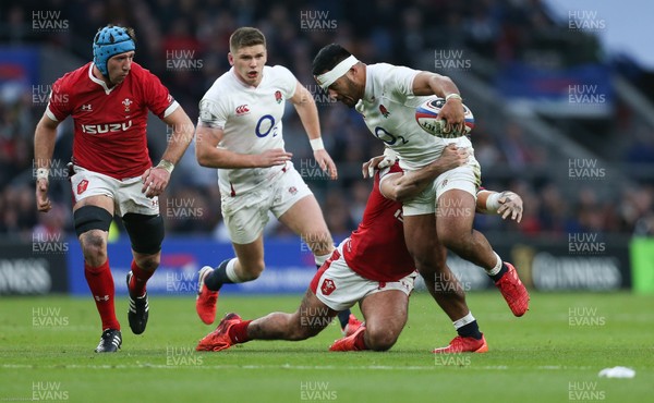 070320 - England v Wales, Guinness Six Nations 2020 - Manu Tuilagi of England is tackled by Josh Navidi of Wales